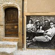 Old door and picture with Provençal scene in the old Roman town Vaison-La-Romaine, Provence, France